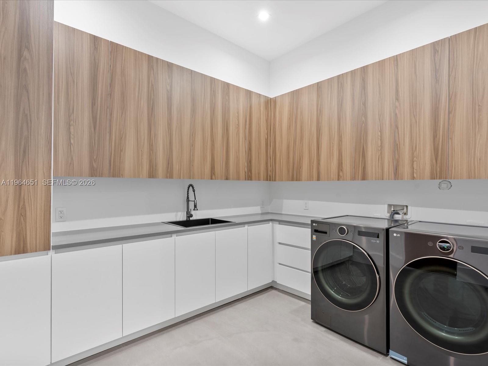 871 Northeast 83rd Street Miami, FL 33138 - Photo 49 of 54 a utility room with sink dryer and washer