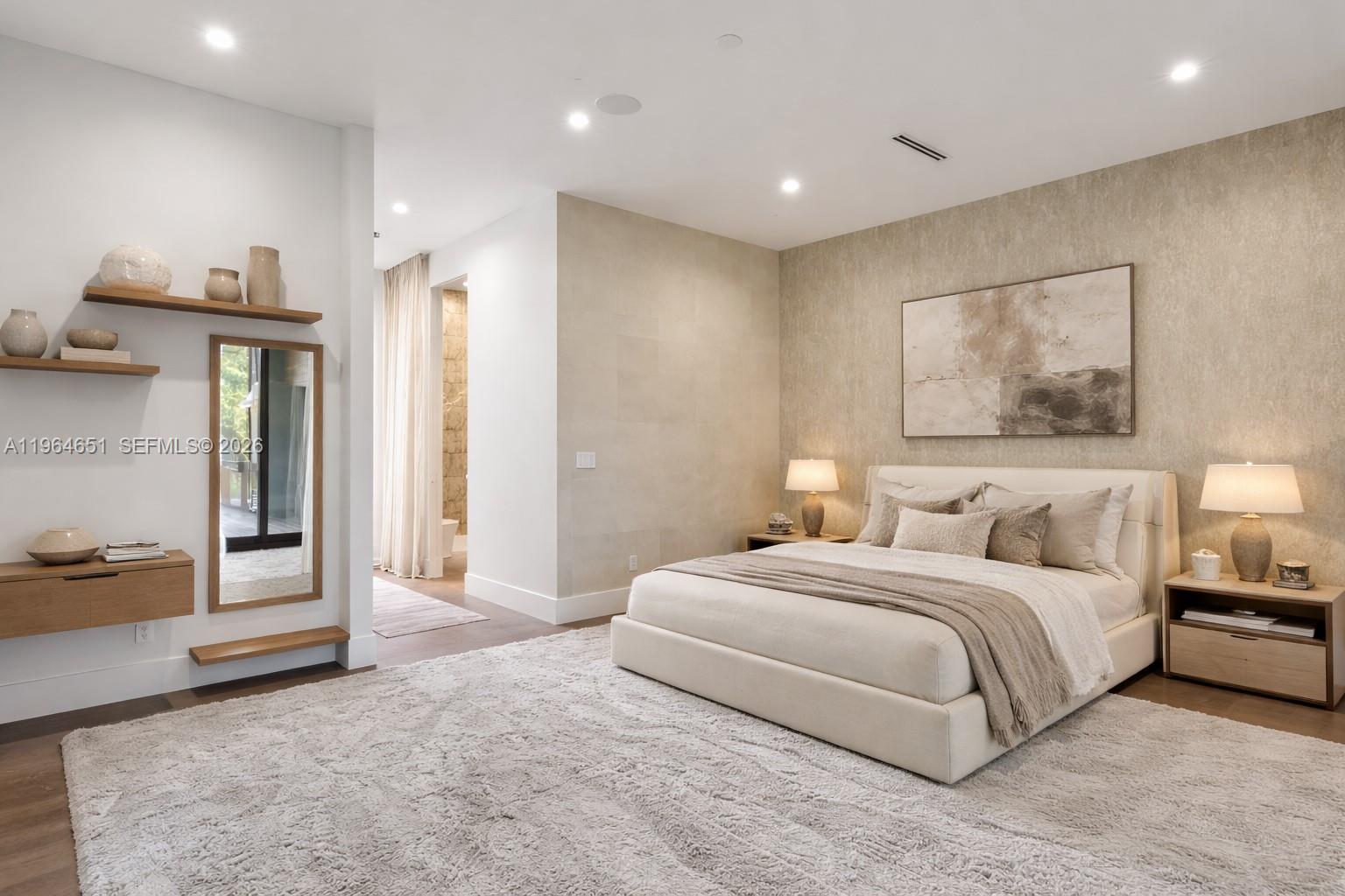 871 Northeast 83rd Street Miami, FL 33138 - Photo 5 of 54 a bedroom with a large bed and painting on the wall