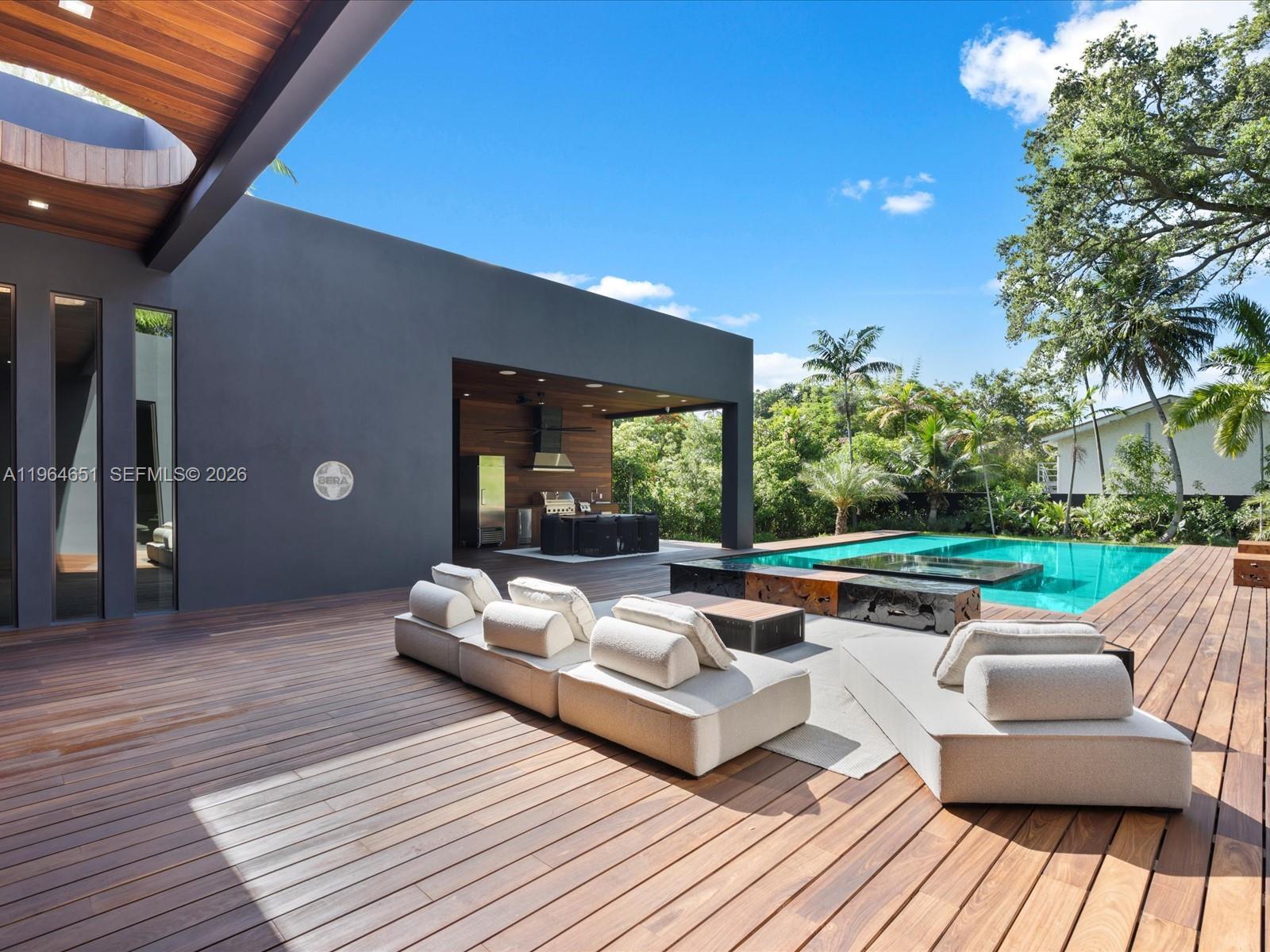 871 Northeast 83rd Street Miami, FL 33138 - Photo 9 of 54 a outdoor space with patio couches and a table