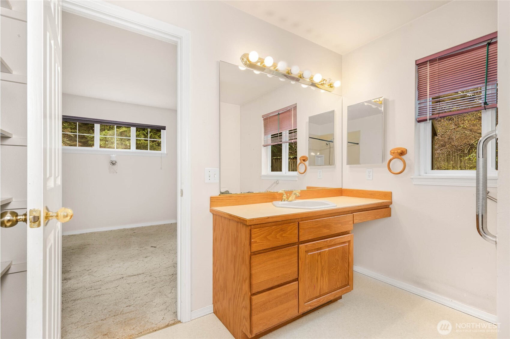 14638 Gibralter Road Anacortes, WA 98221 - Photo 11 of 25 a bathroom with a sink a vanity and a mirror