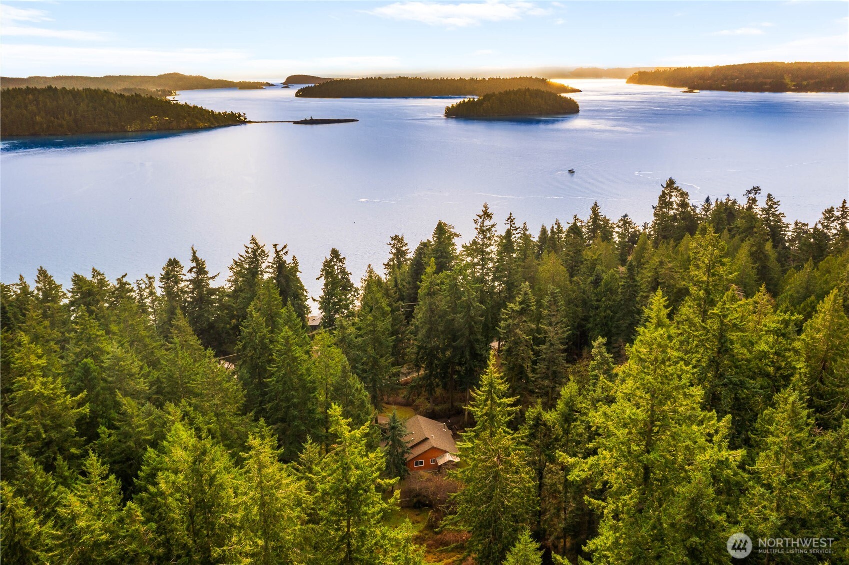 14638 Gibralter Road Anacortes, WA 98221 - Photo 2 of 25 a view of a lake and mountain in the back