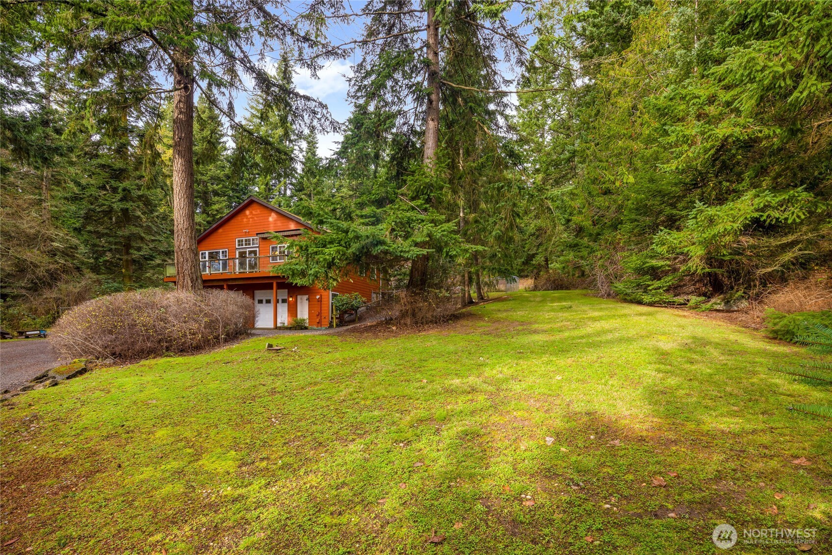 14638 Gibralter Road Anacortes, WA 98221 - Photo 22 of 25 a yellow house with swimming pool in front of it