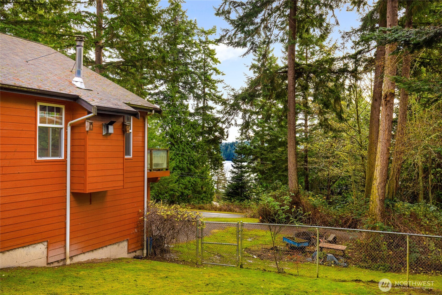 14638 Gibralter Road Anacortes, WA 98221 - Photo 25 of 25 a view of a chairs in the patio next to a yard