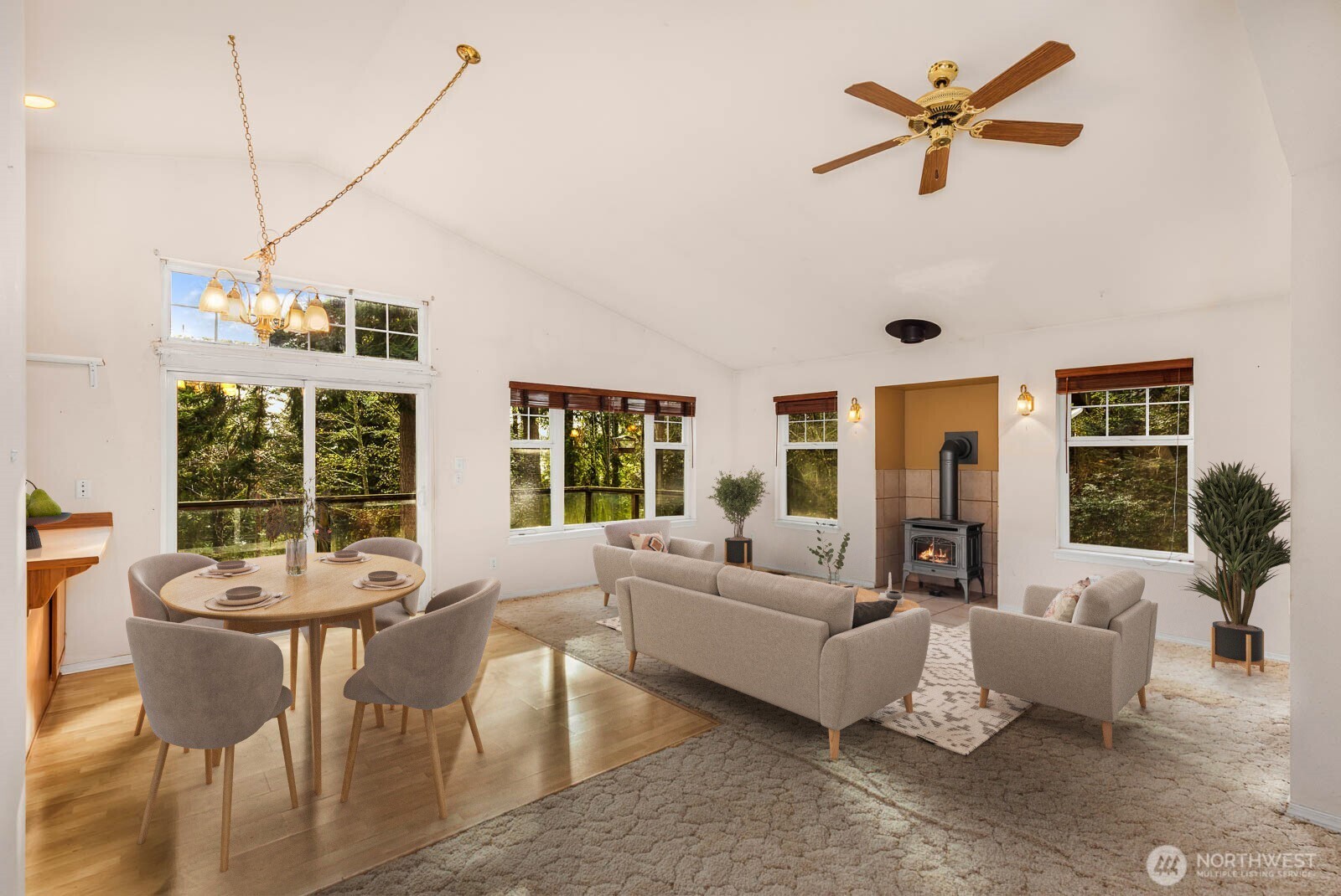 14638 Gibralter Road Anacortes, WA 98221 - Photo 4 of 25 a living room with furniture ceiling fan and a large window