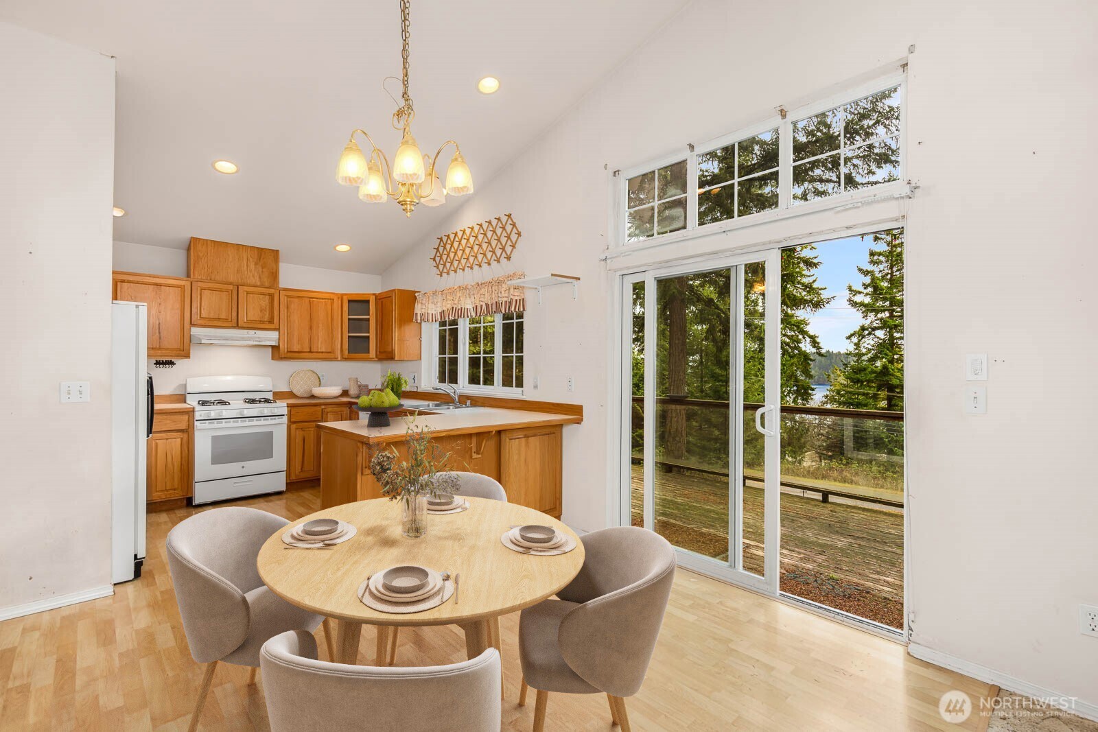 14638 Gibralter Road Anacortes, WA 98221 - Photo 8 of 25 a large kitchen with a table and chairs