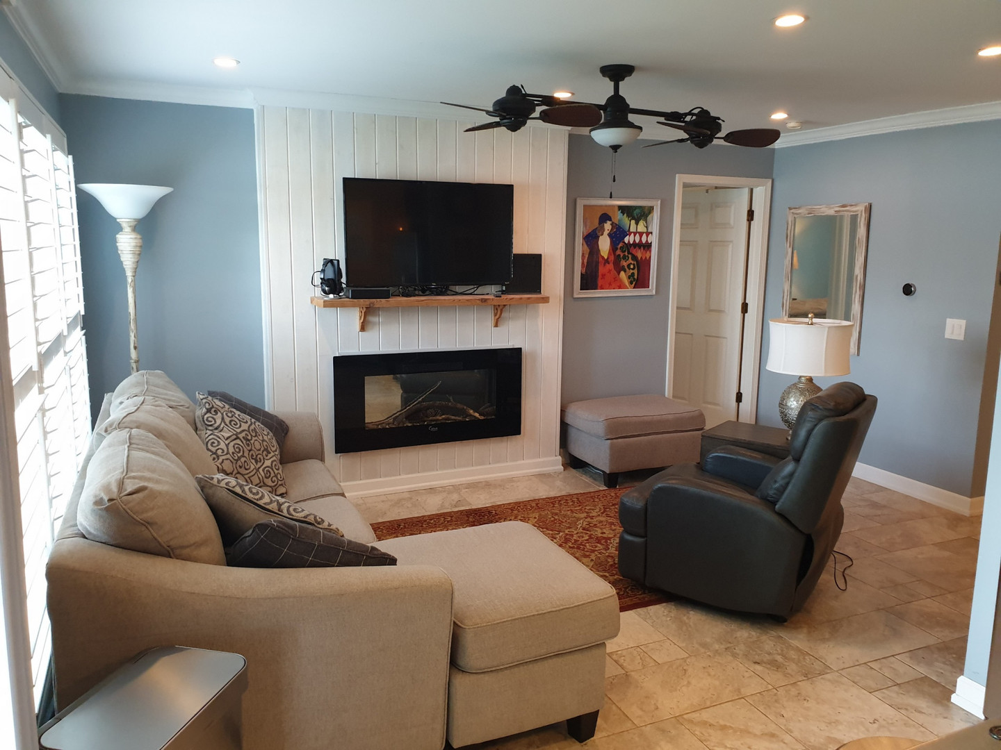 1068 Ridgefield Circle Carol Stream, IL 60188 - Photo 5 of 15 a living room with furniture a flat screen tv and a fireplace