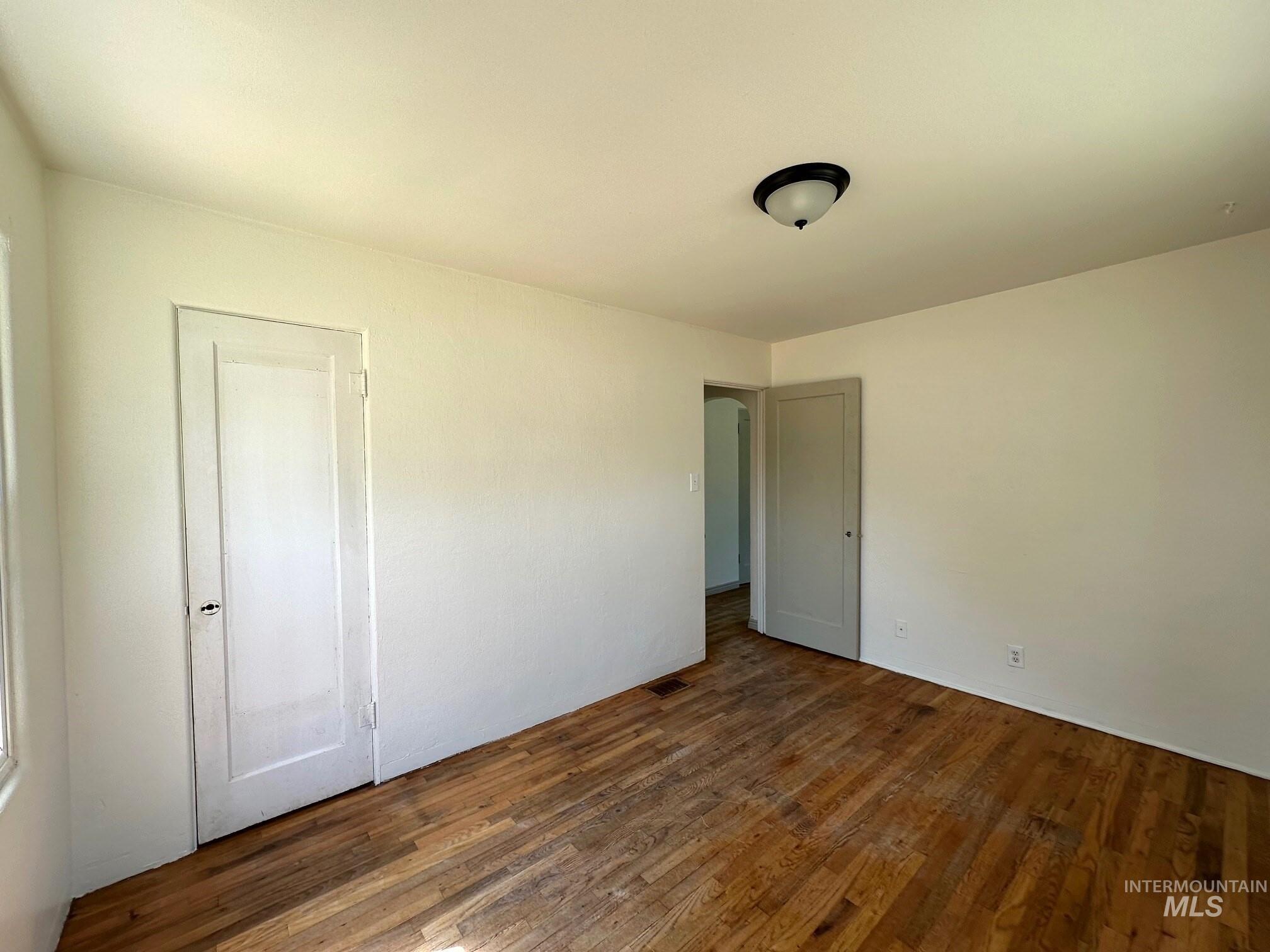 264 Southwest 10th Avenue Ontario, OR 97914 - Photo 12 of 29 Empty room featuring wood finished floors