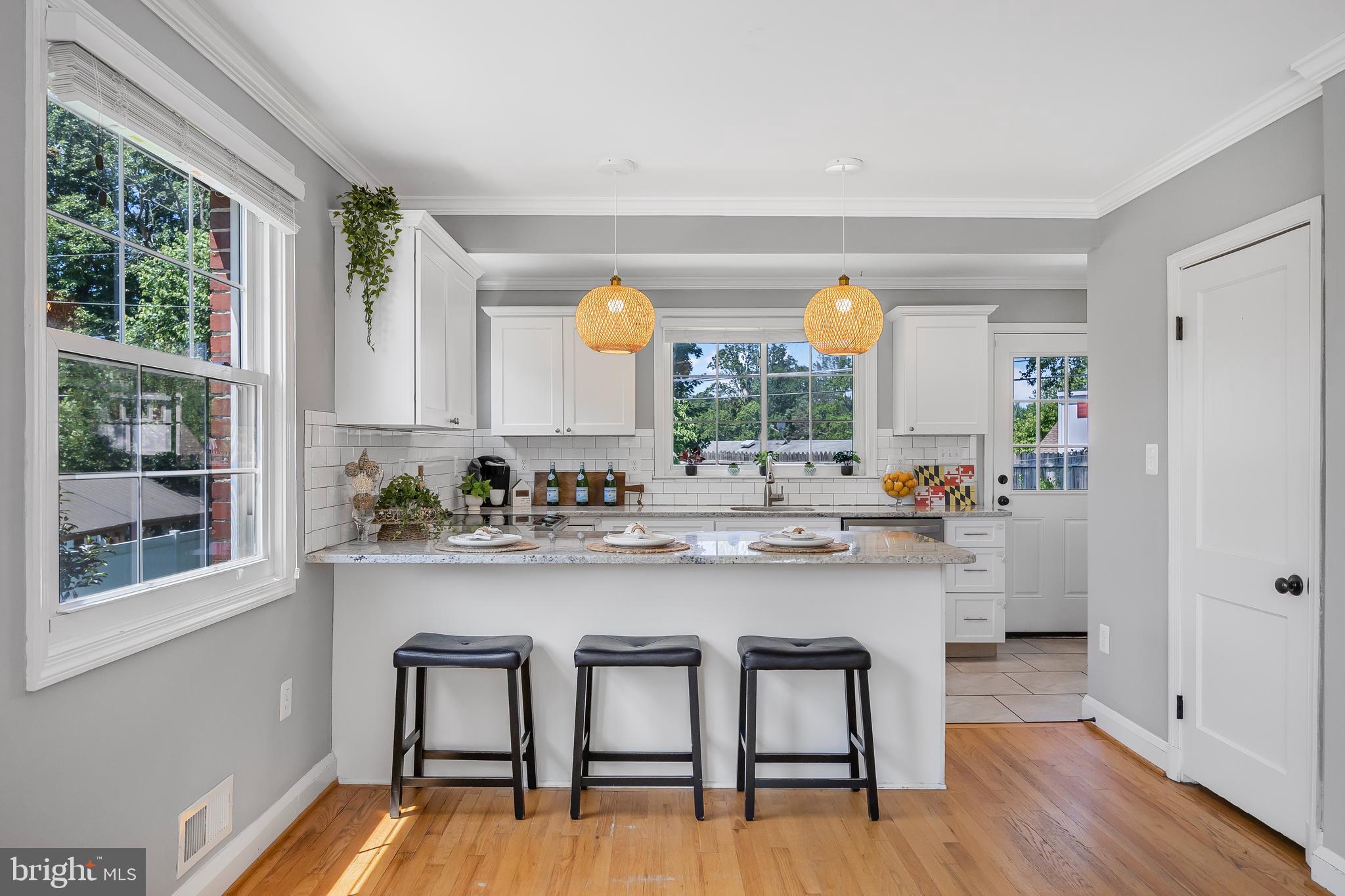 1305 Heather Hill Road Baltimore, MD 21239 - Photo 13 of 50 Kitchen w/ white cabinets & granite countertops