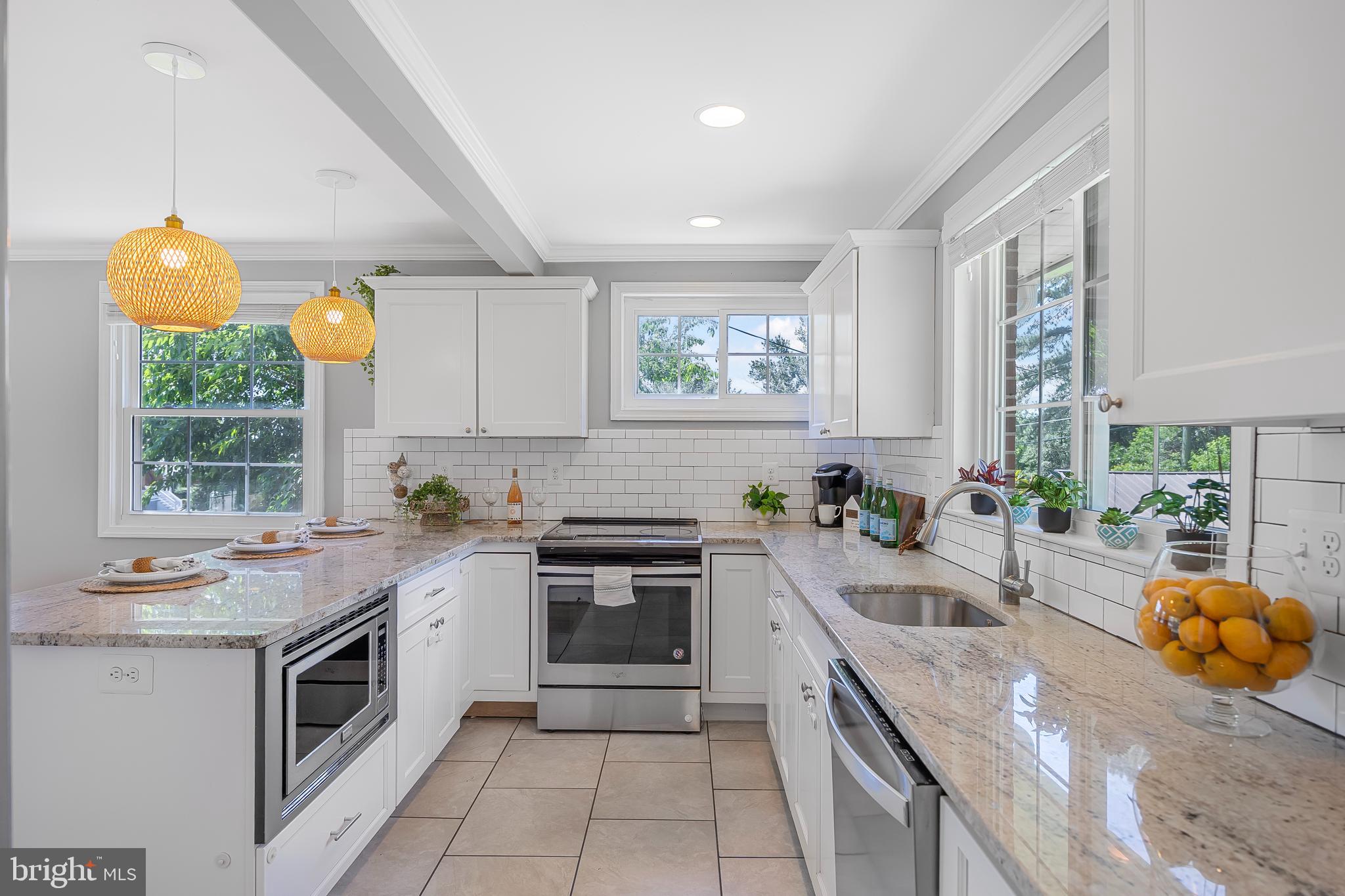 1305 Heather Hill Road Baltimore, MD 21239 - Photo 17 of 50 Kitchen w/ white cabinets & granite countertops
