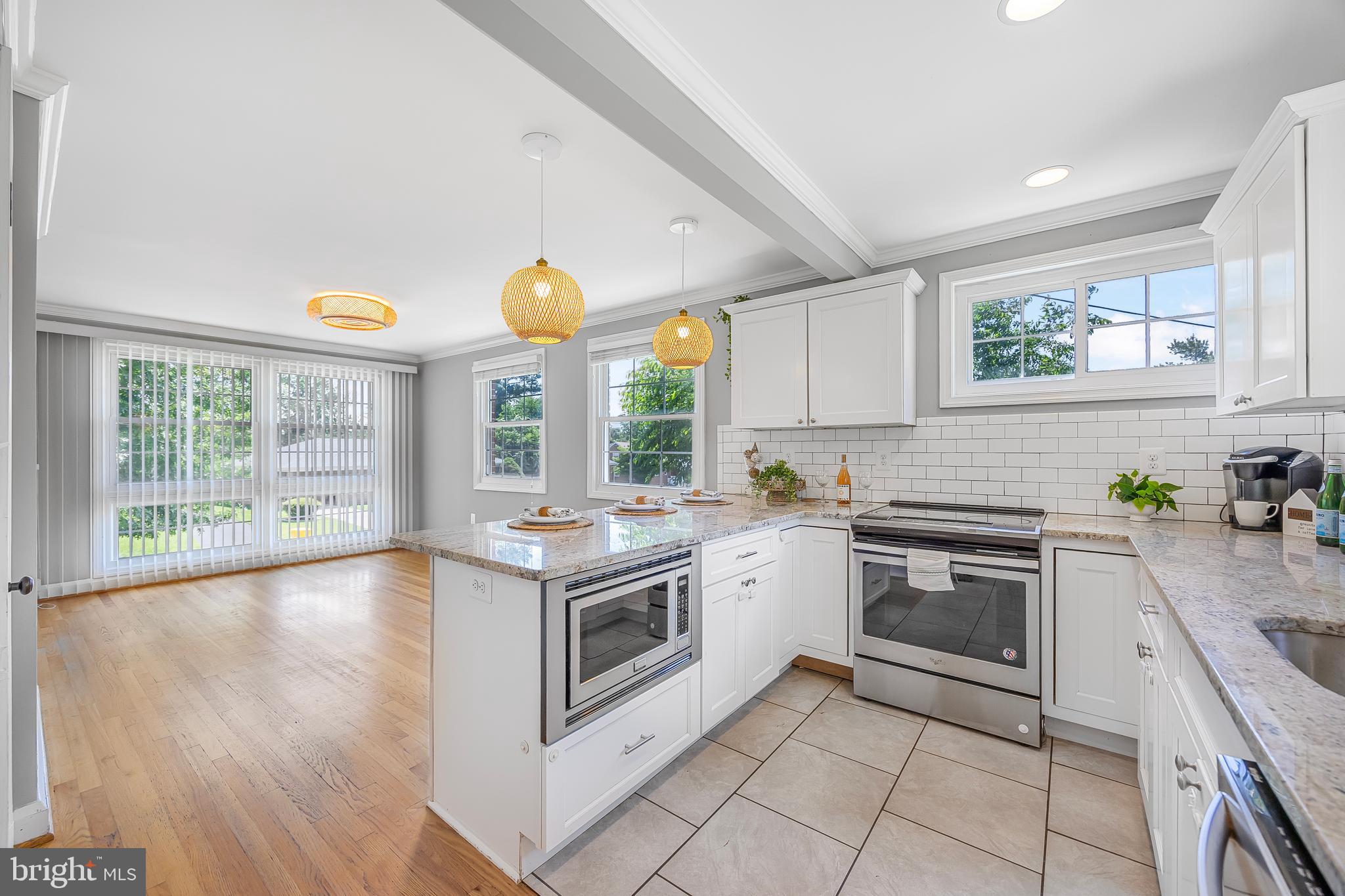 1305 Heather Hill Road Baltimore, MD 21239 - Photo 18 of 50 Kitchen w/ white cabinets & granite countertops