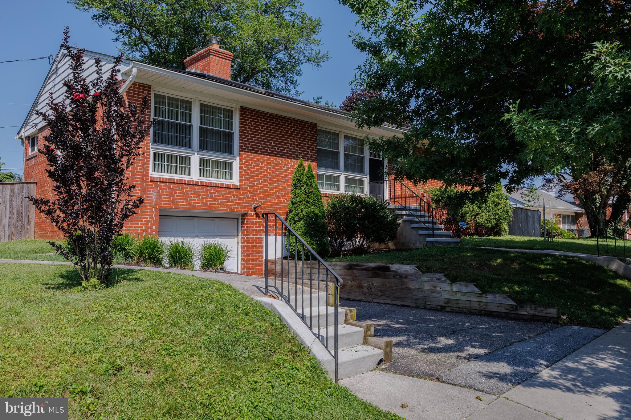 1305 Heather Hill Road Baltimore, MD 21239 - Photo 3 of 50 house front w/ neat lawn & surrounding trees