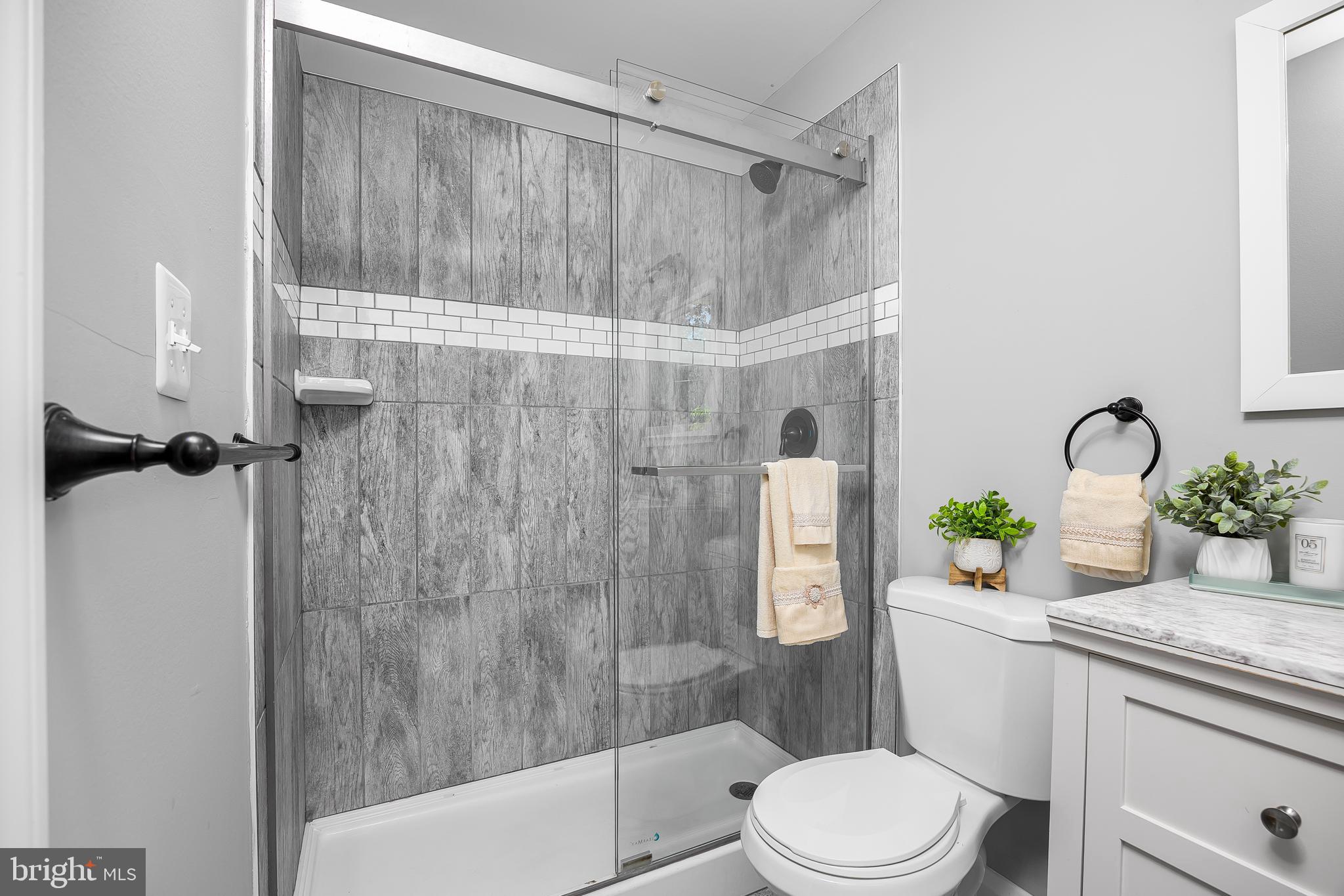 1305 Heather Hill Road Baltimore, MD 21239 - Photo 31 of 50 Bathroom w/ shower stall and glass doors