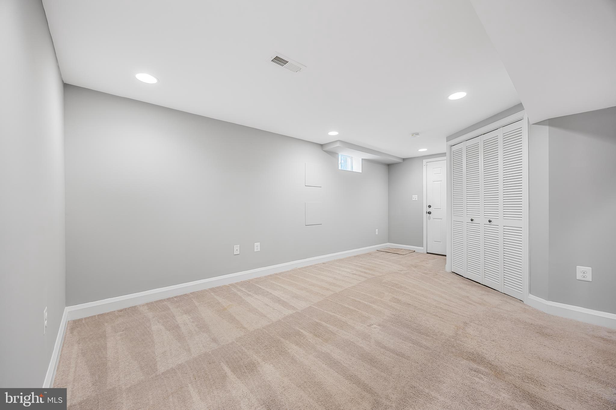 1305 Heather Hill Road Baltimore, MD 21239 - Photo 34 of 50 A brightly lit, empty basement room