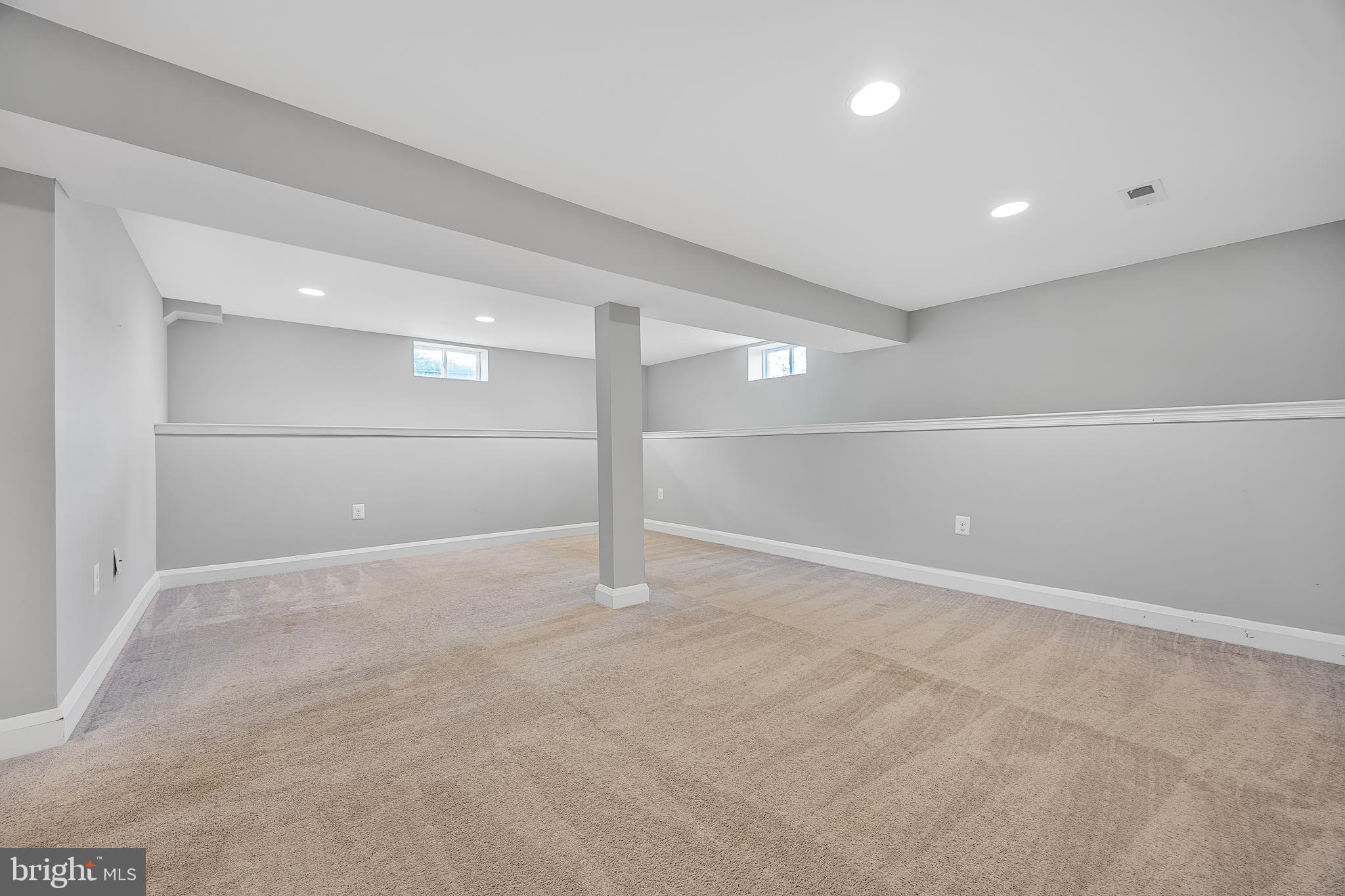 1305 Heather Hill Road Baltimore, MD 21239 - Photo 38 of 50 well-lit basement room with beige carpet