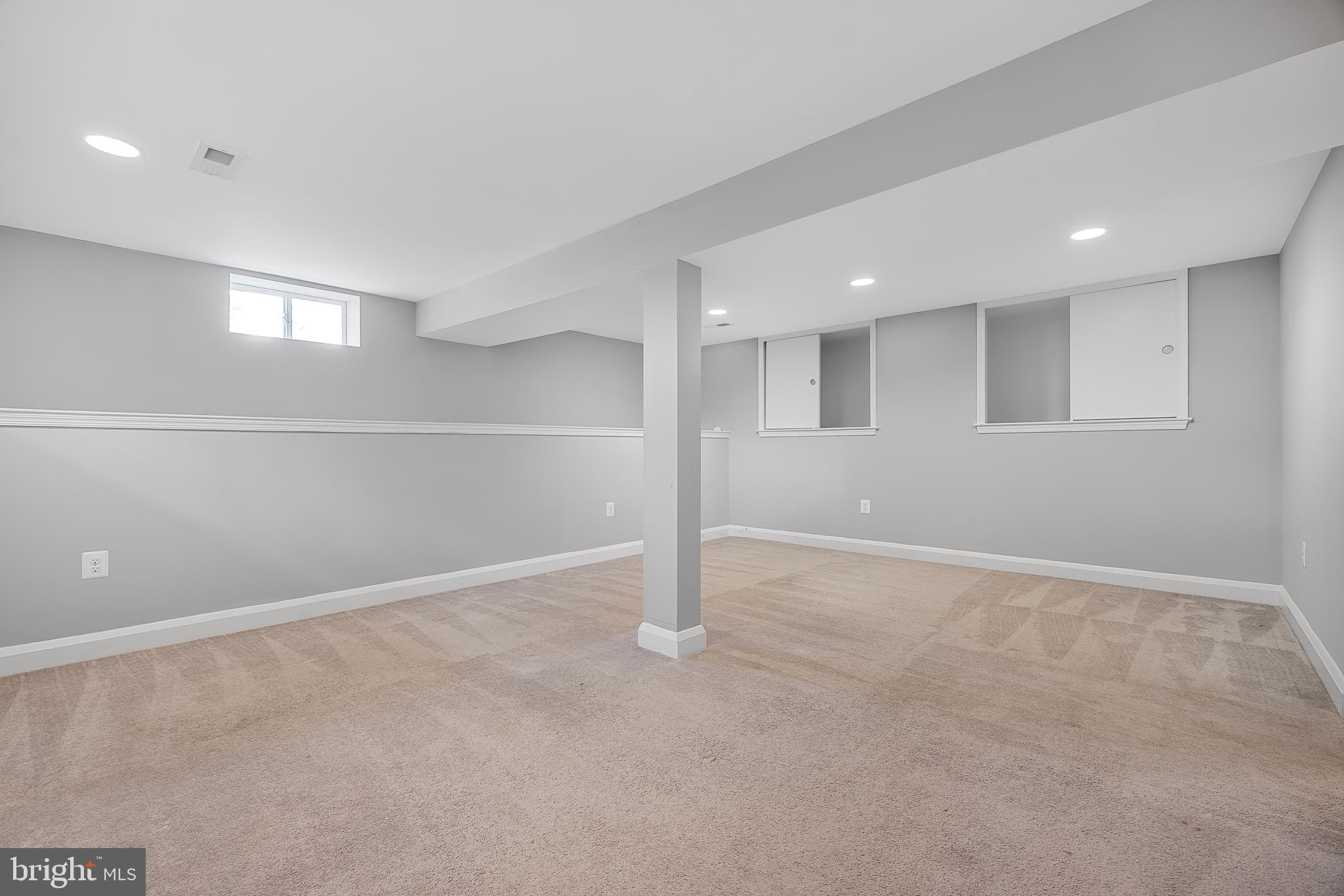 1305 Heather Hill Road Baltimore, MD 21239 - Photo 39 of 50 well-lit basement room with beige carpet