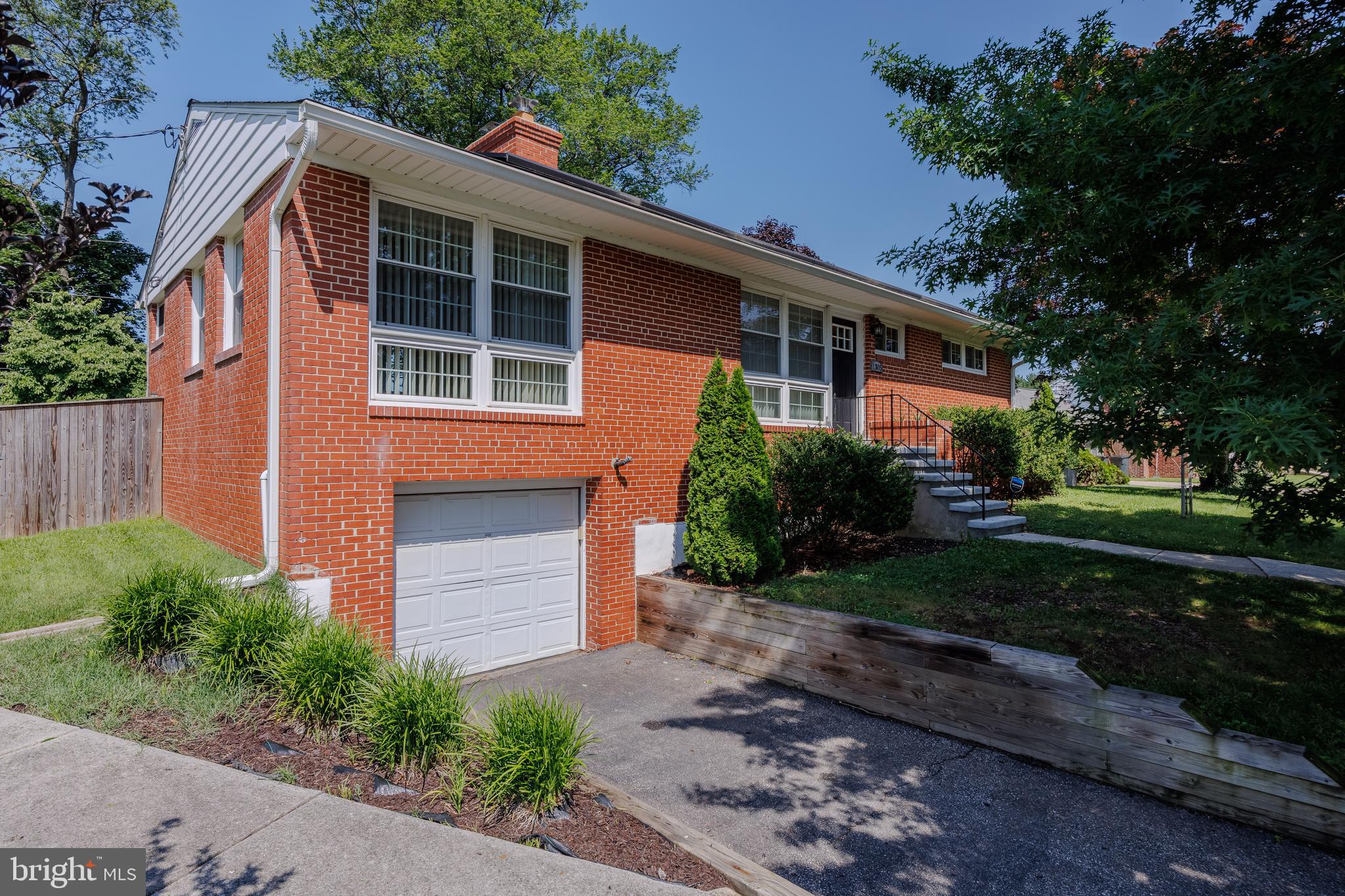 1305 Heather Hill Road Baltimore, MD 21239 - Photo 4 of 50 house front w/ neat lawn & surrounding trees