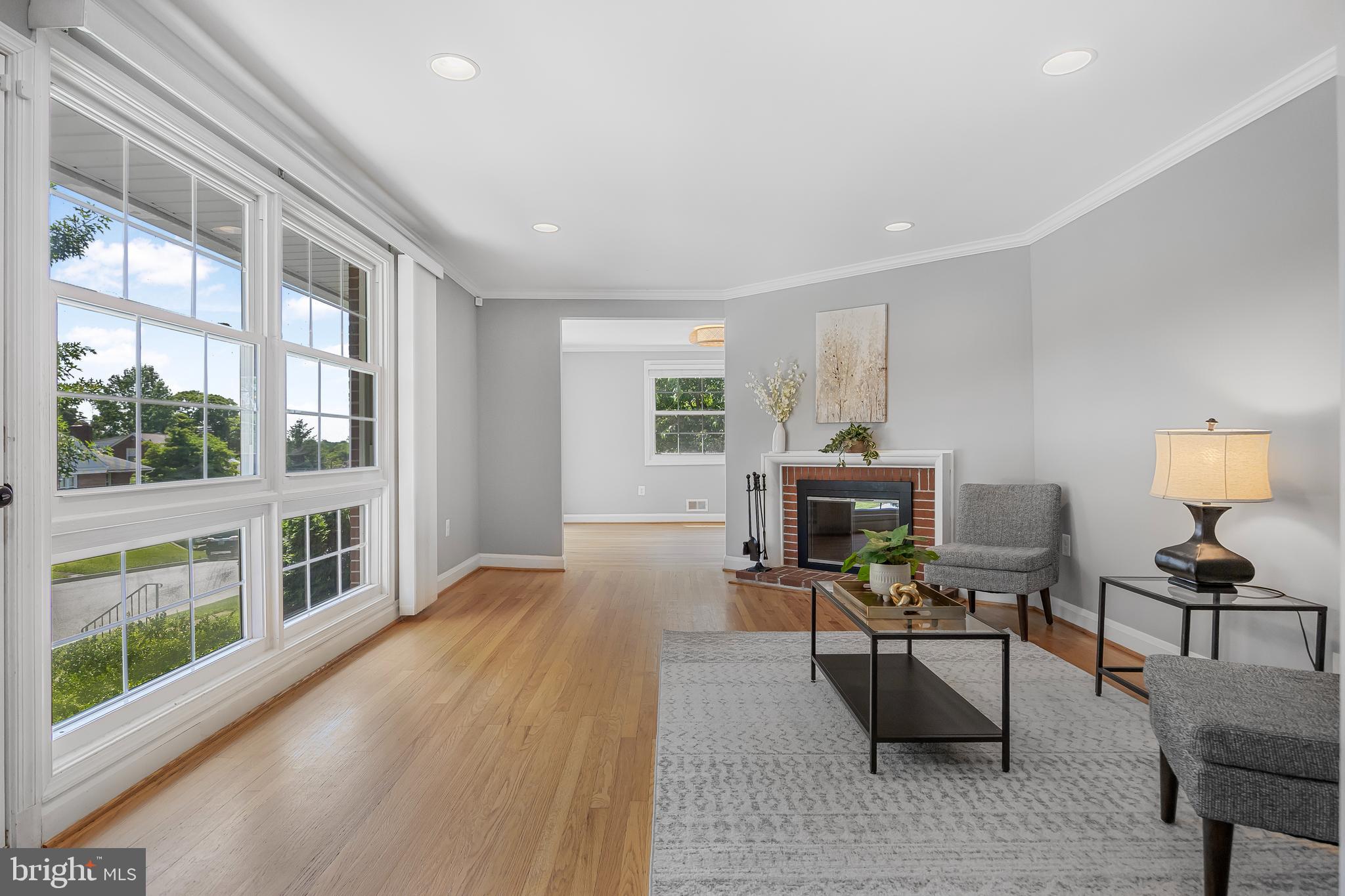1305 Heather Hill Road Baltimore, MD 21239 - Photo 7 of 50 A brightly lit living room w/ hardwood floors