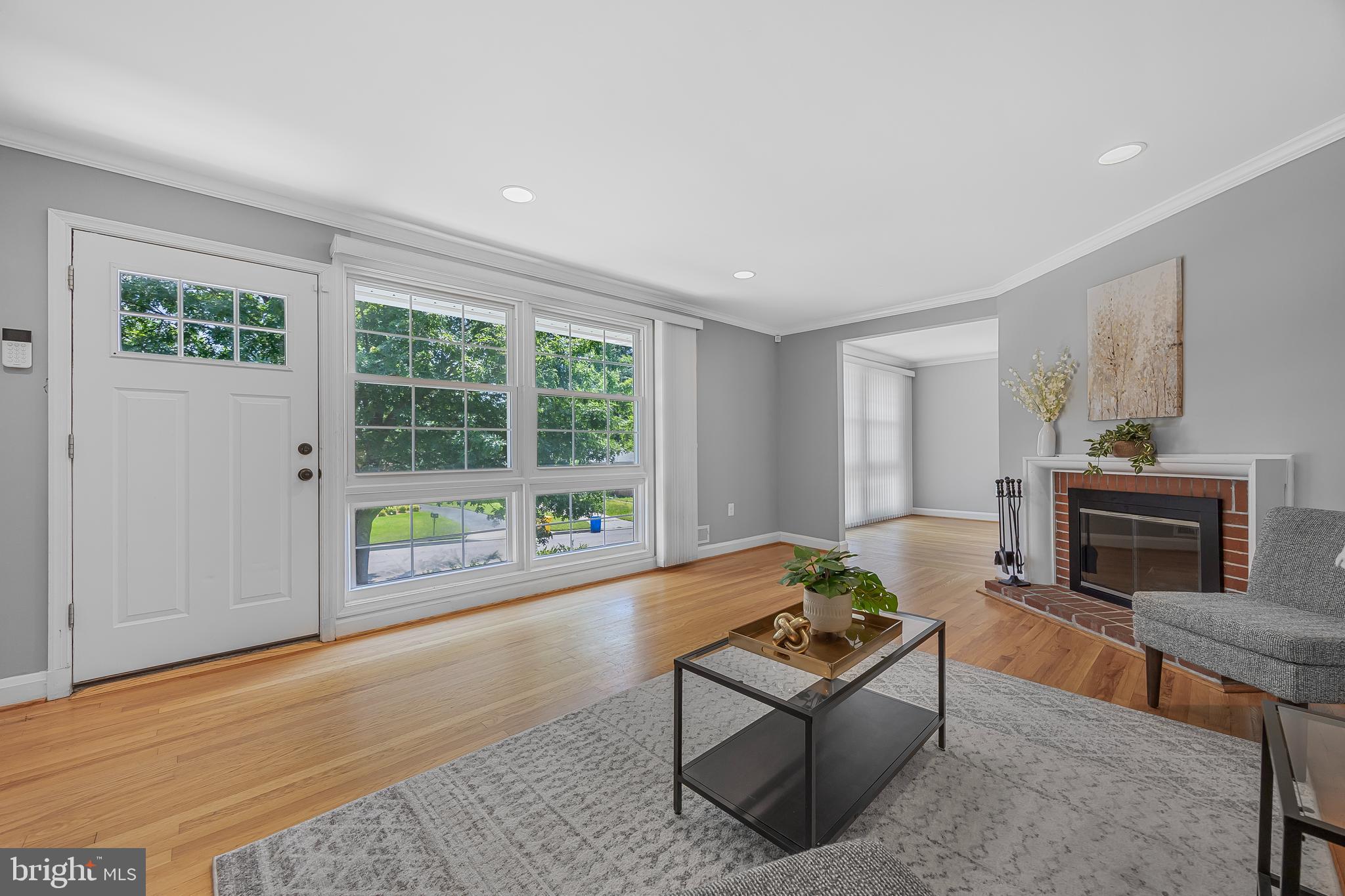 1305 Heather Hill Road Baltimore, MD 21239 - Photo 8 of 50 A brightly lit living room w/ hardwood floors