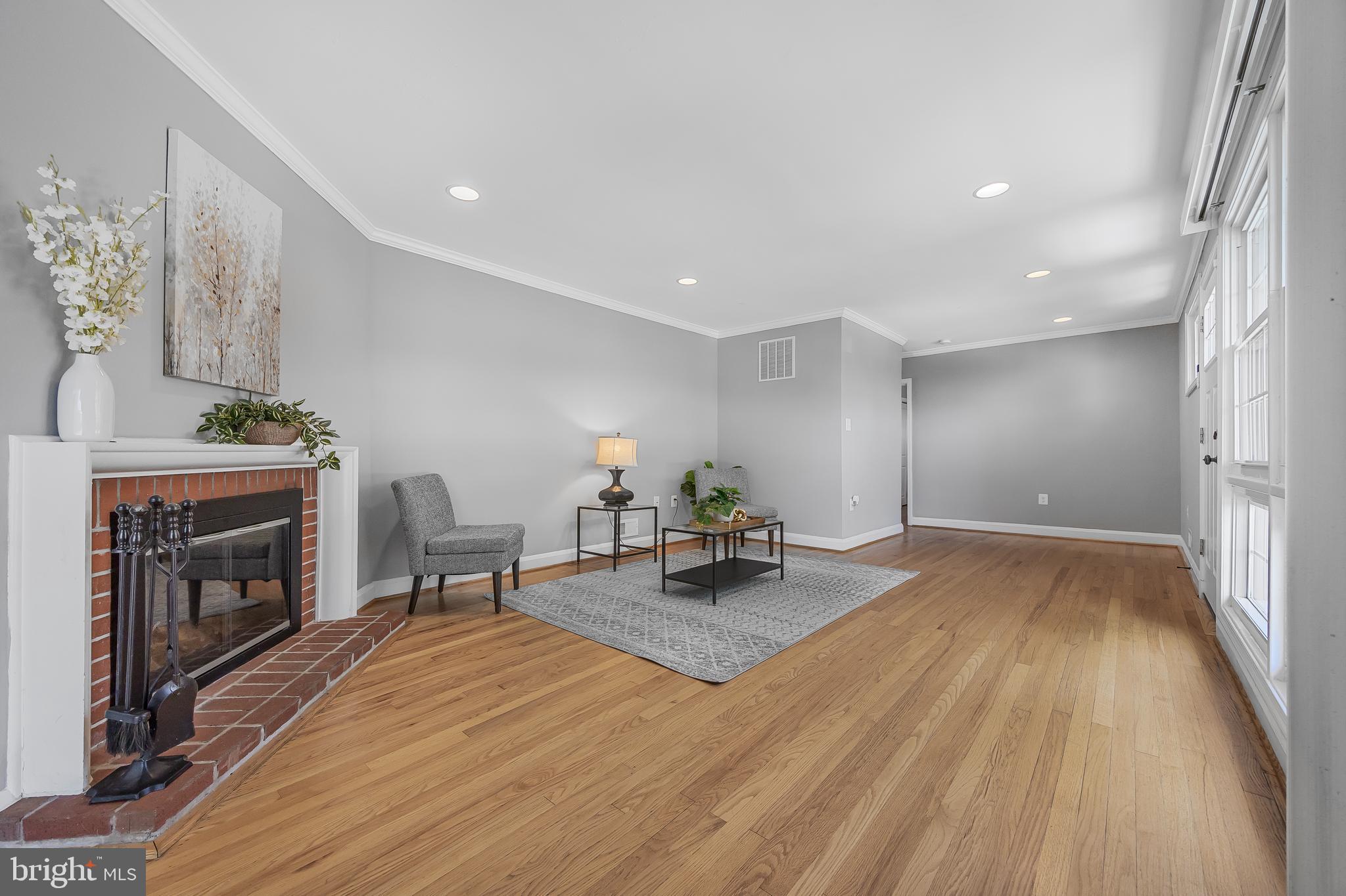 1305 Heather Hill Road Baltimore, MD 21239 - Photo 9 of 50 A brightly lit living room w/ hardwood floors