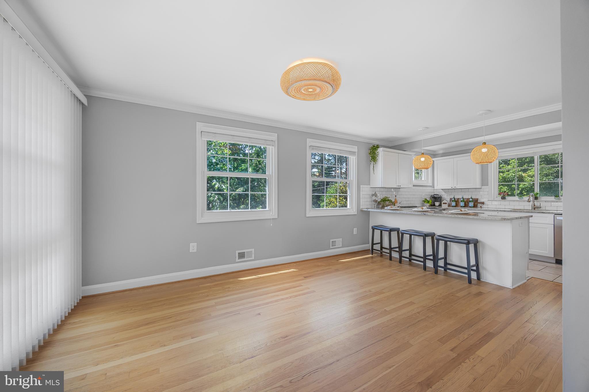 1305 Heather Hill Road Baltimore, MD 21239 - Photo 10 of 50 Spacious kitchen w/ white cabinets & hardwood flrs
