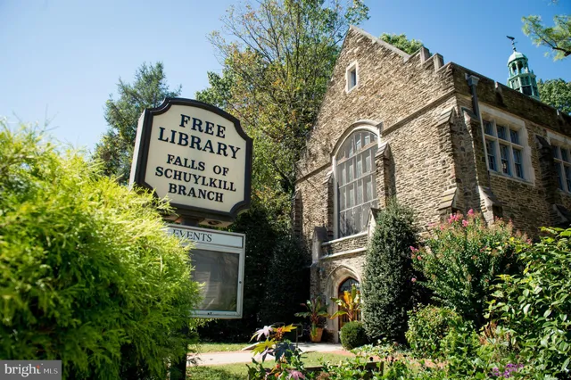 a view of a street with a building in the background