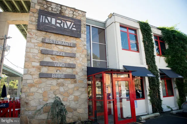 a view of street with an entrance and house
