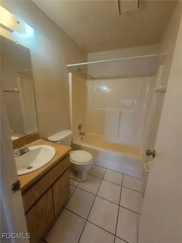 a view of balcony with floor to ceiling window and mountain