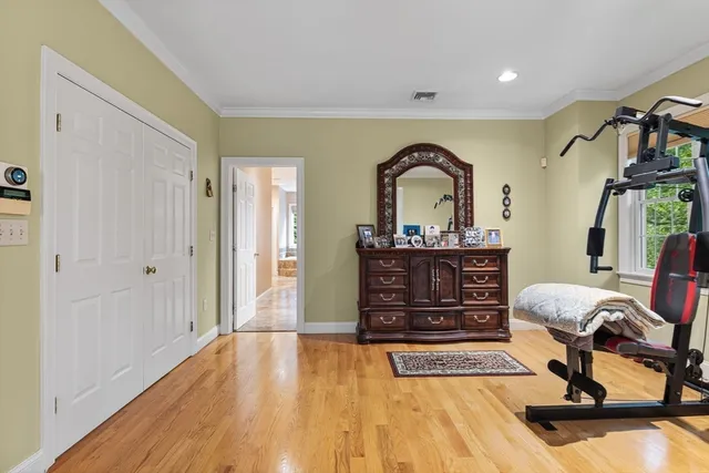a living room with furniture a piano and a dresser