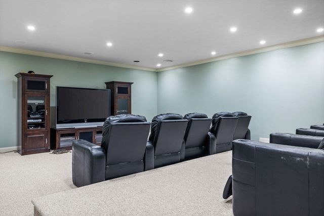a living room with couch and a flat screen tv