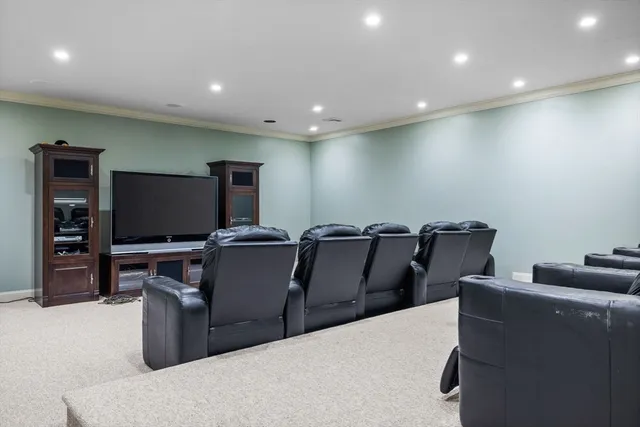 a living room with couch and a flat screen tv