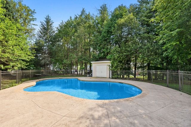 a view of a swimming pool with an outdoor space