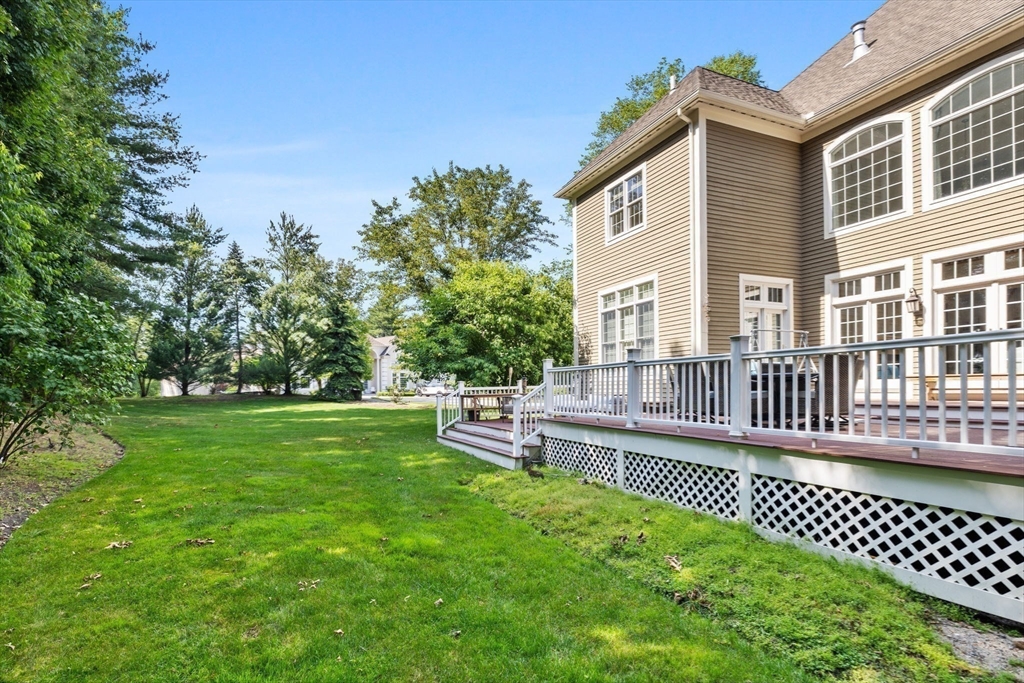 6 Ashley Court Lynnfield, MA 01940 - Photo 38 of 41 a view of a house with a backyard and a patio