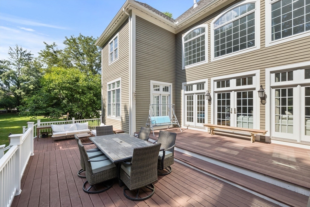 6 Ashley Court Lynnfield, MA 01940 - Photo 4 of 41 a view of a house with backyard sitting area and garden