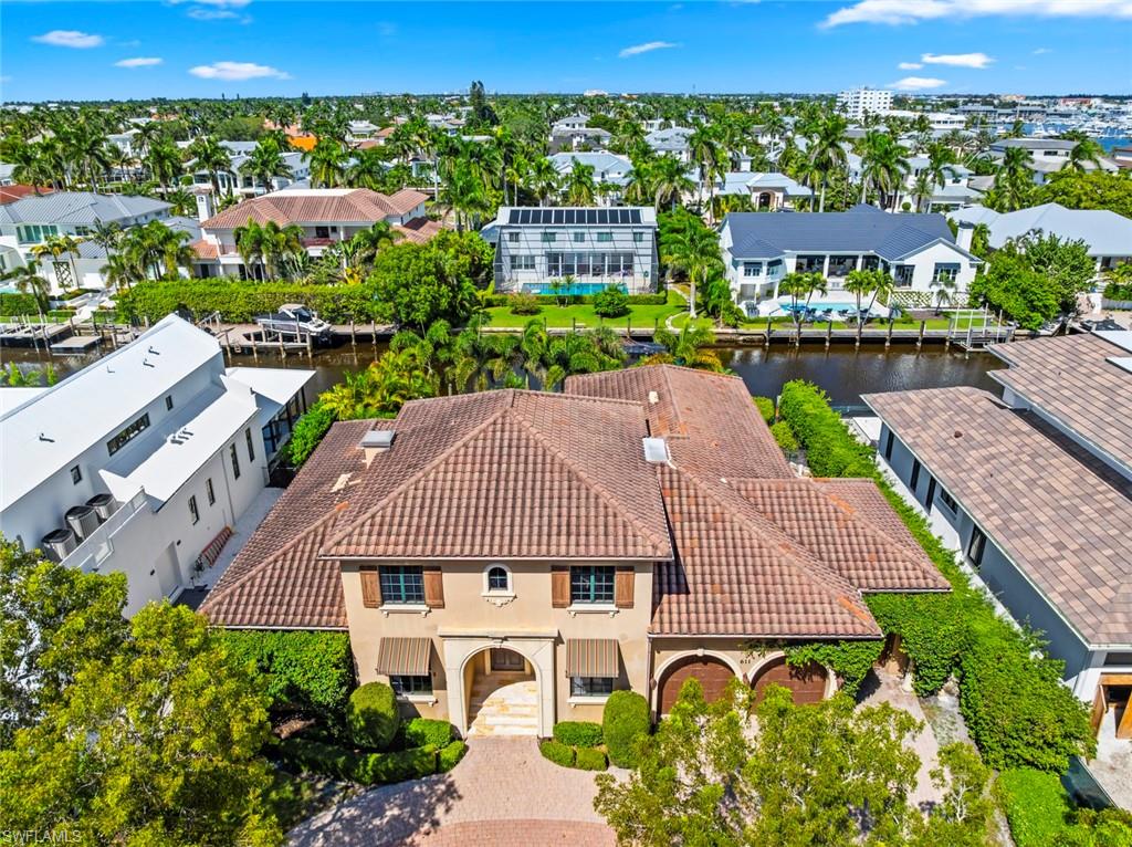 611 18th Avenue South Naples, FL 34102 - Photo 42 of 44 Aerial perspective of suburban area featuring a nearby body of water
