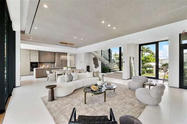 a kitchen with granite countertop a sink a stove and cabinets
