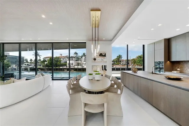 a large living room with furniture and a large window