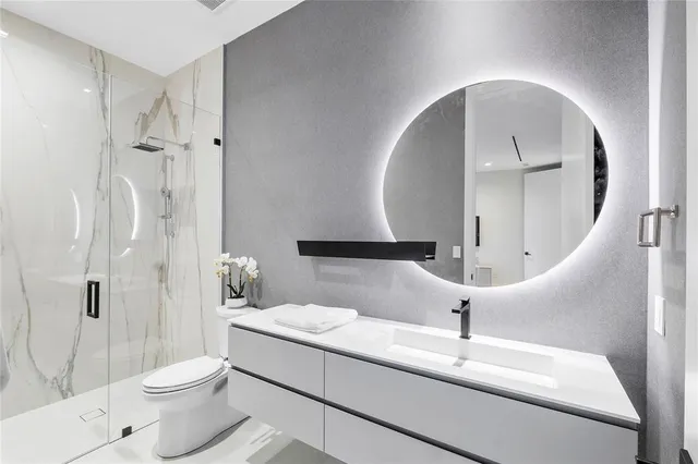 a living room with a large window and a flat screen tv