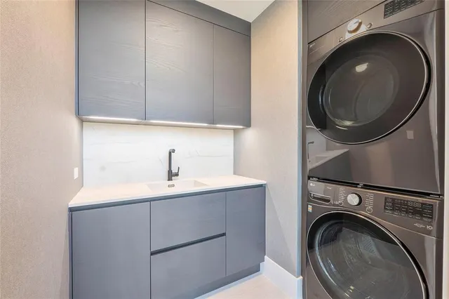 a bathroom with a double vanity sink and mirror