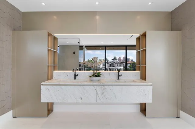 a view of swimming pool with red chairs