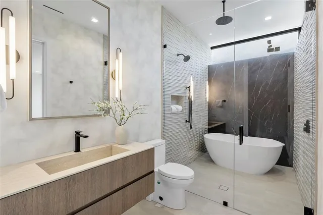 a dining room with furniture and a floor to ceiling window