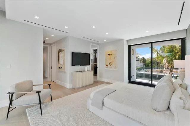 a view of a swimming pool with outdoor seating