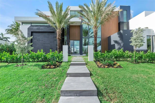 a kitchen with counter top space and living room