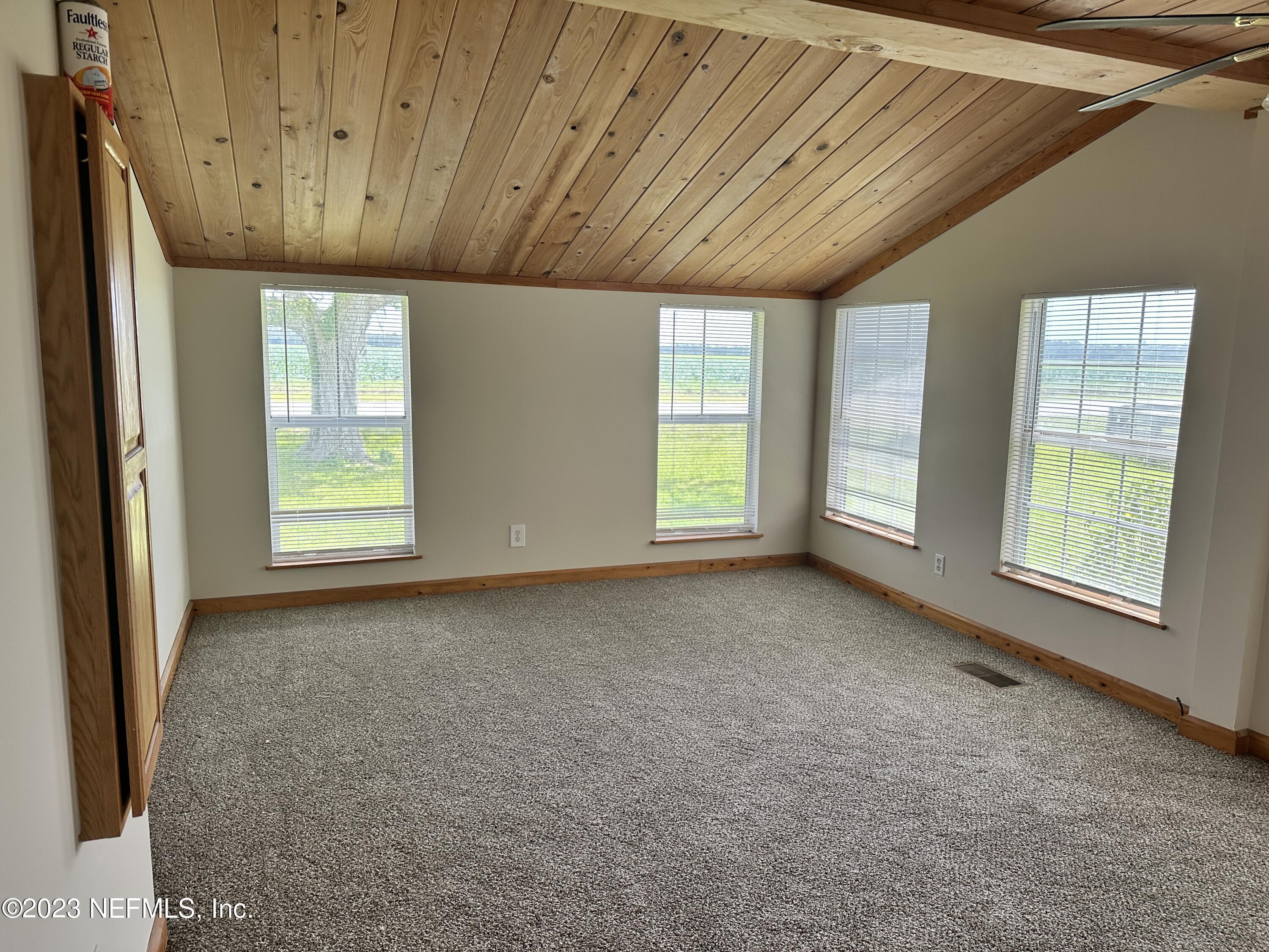9465 Cowpen Branch Road, Unit A Hastings, FL 32145 - Photo 12 of 21 a view of an empty room with a window