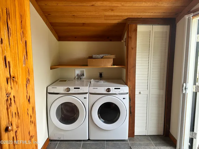 a utility room with dryer and washer
