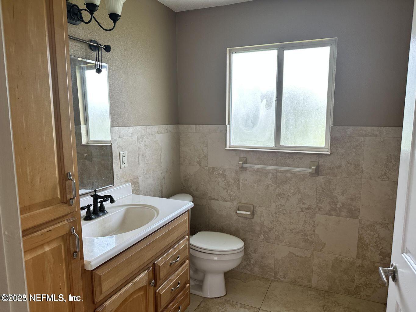 9465 Cowpen Branch Road, Unit A Hastings, FL 32145 - Photo 19 of 21 a bathroom with a sink toilet and shower