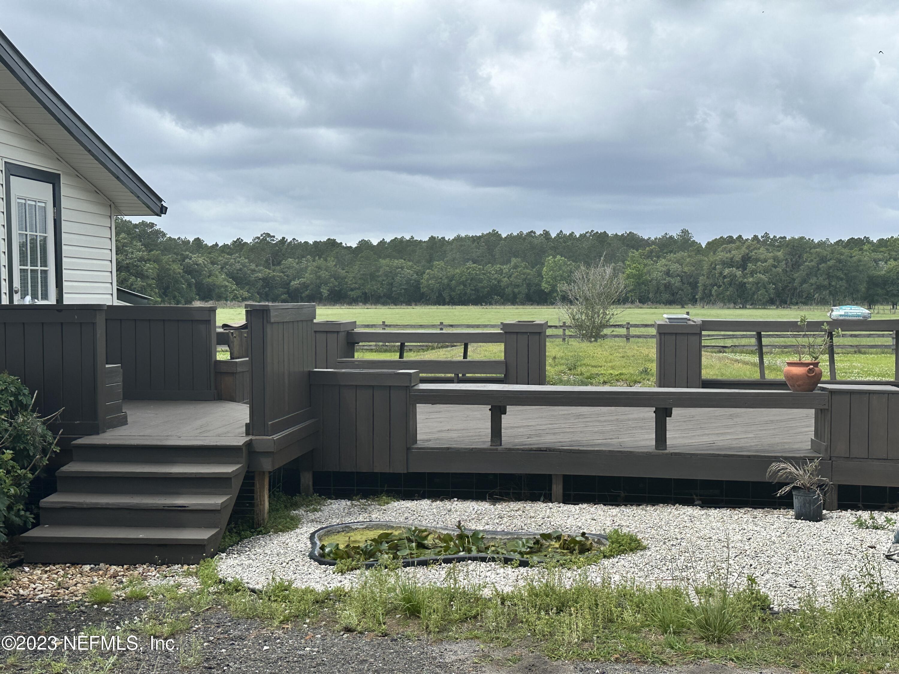 9465 Cowpen Branch Road, Unit A Hastings, FL 32145 - Photo 2 of 21 a view of outdoor space with deck and yard