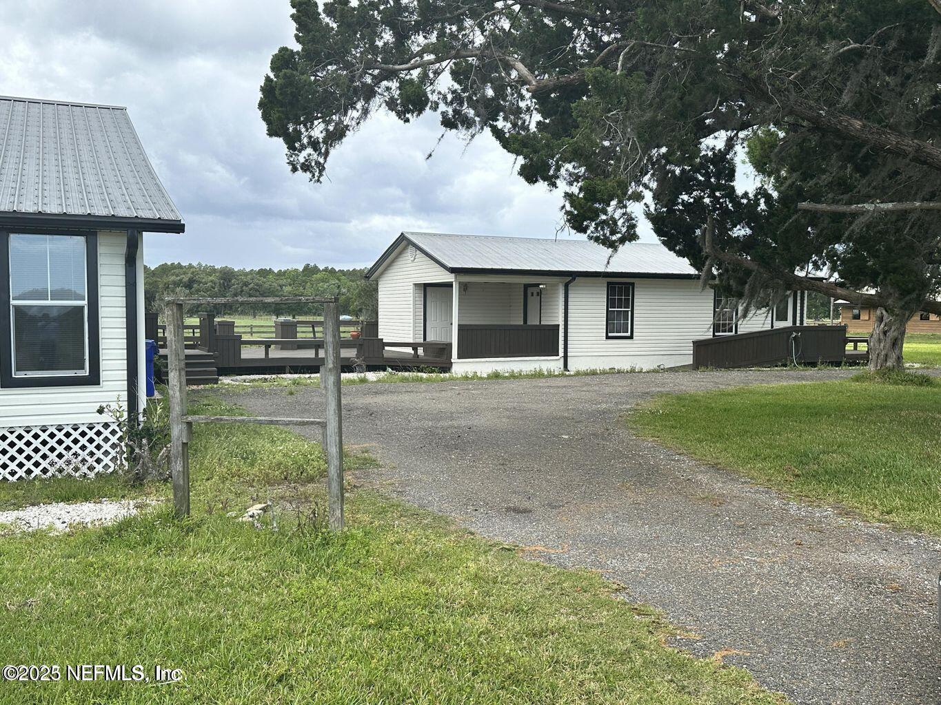 9465 Cowpen Branch Road, Unit A Hastings, FL 32145 - Photo 21 of 21 a front view of a house with a yard