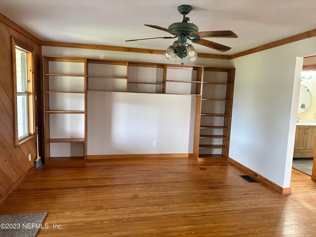 a view of a livingroom with wooden floor