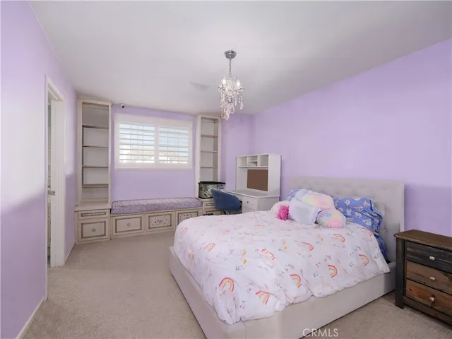 a bedroom with a bed and a table