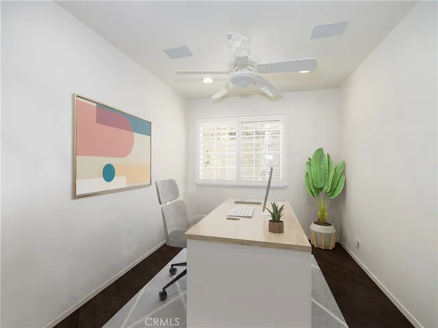 a workspace with furniture and window